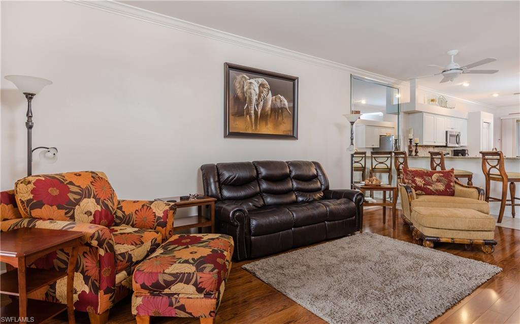 21468 Knighton Run Estero, FL 33928 - Photo 9 of 21 a living room with furniture and a couch