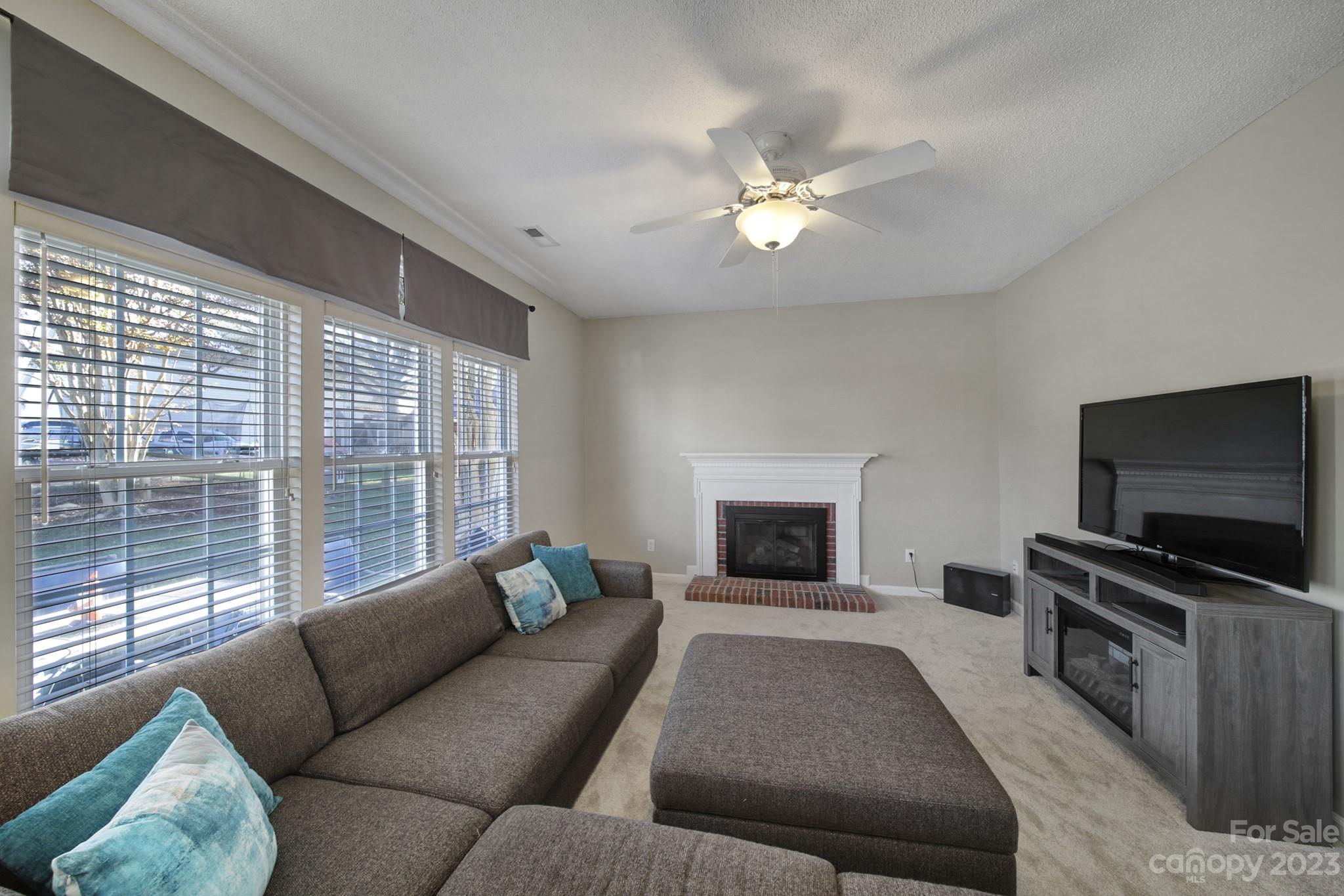 524 Whitehead Court Fort Mill, SC 29708 - Photo 16 of 45 a living room with furniture and a flat screen tv