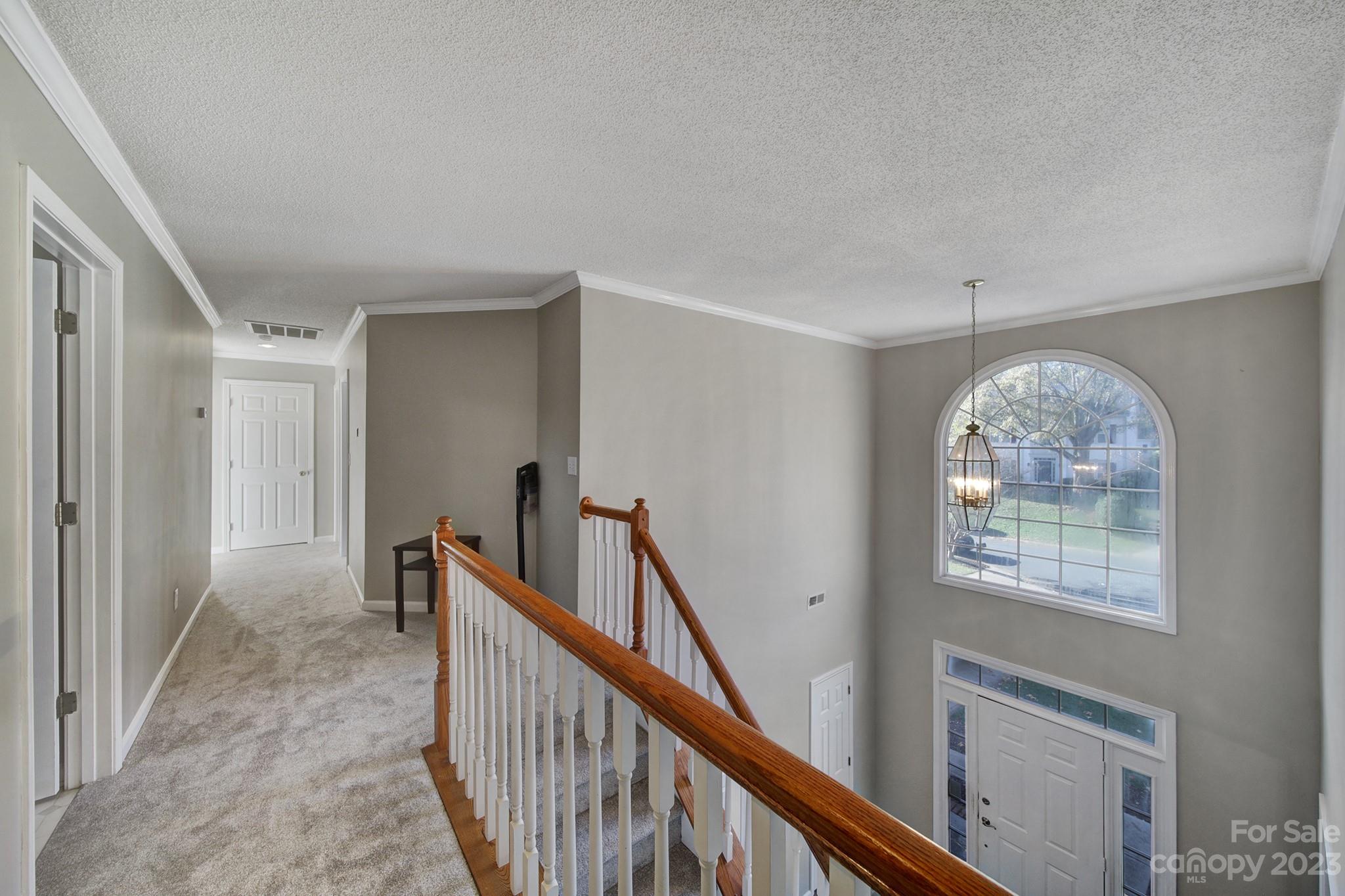 524 Whitehead Court Fort Mill, SC 29708 - Photo 18 of 45 a view of an entryway with wooden floor and windows