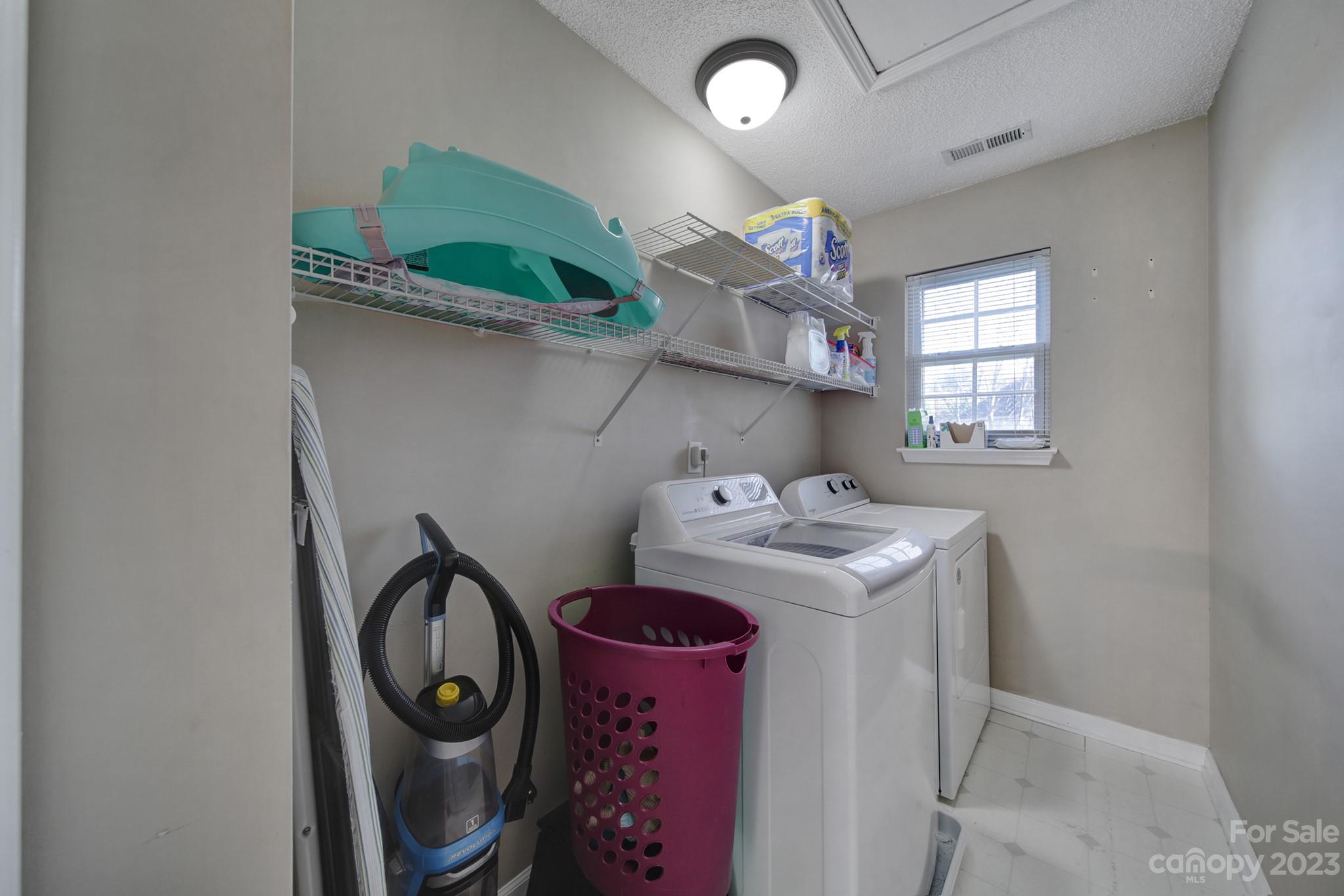 524 Whitehead Court Fort Mill, SC 29708 - Photo 32 of 45 a utility room with dryer and washer