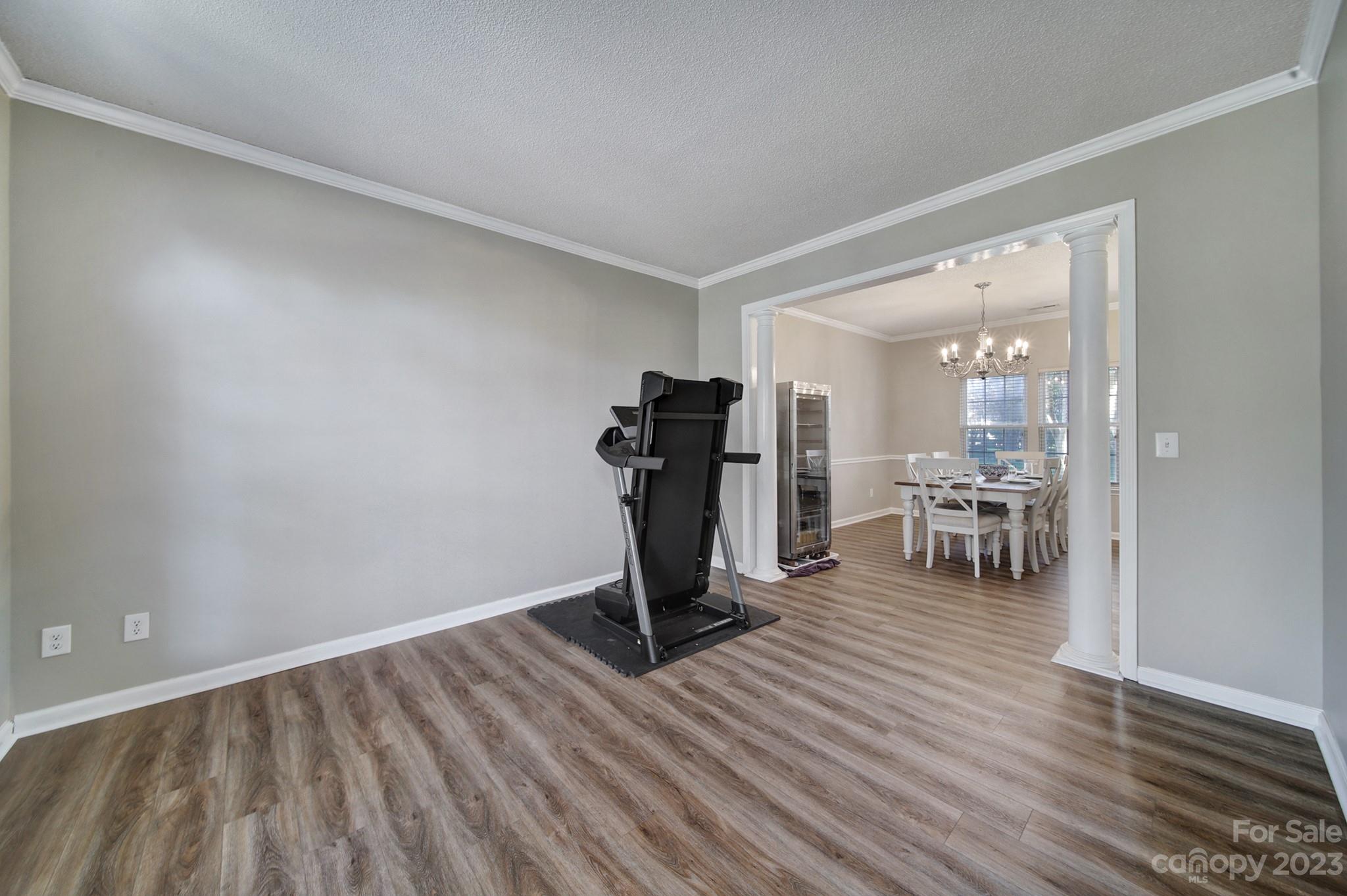 524 Whitehead Court Fort Mill, SC 29708 - Photo 4 of 45 a view of a room with wooden floor furniture and a way to kitchen
