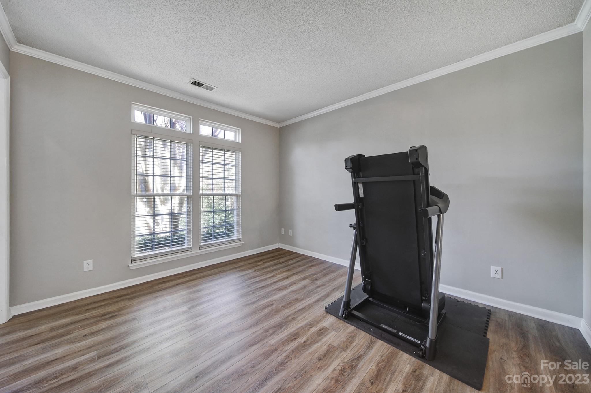524 Whitehead Court Fort Mill, SC 29708 - Photo 5 of 45 a view of an empty room with wooden floor and a window