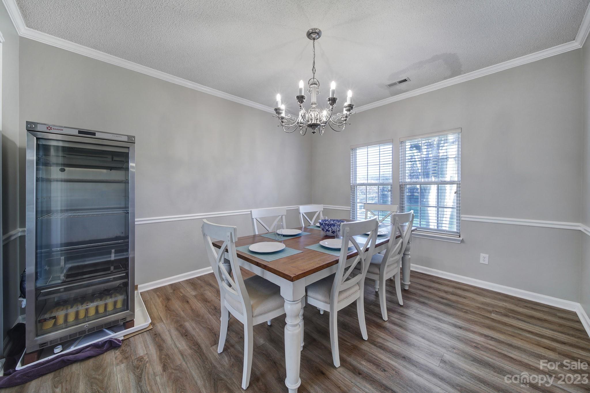 524 Whitehead Court Fort Mill, SC 29708 - Photo 7 of 45 a view of a dining room with furniture window and wooden floor