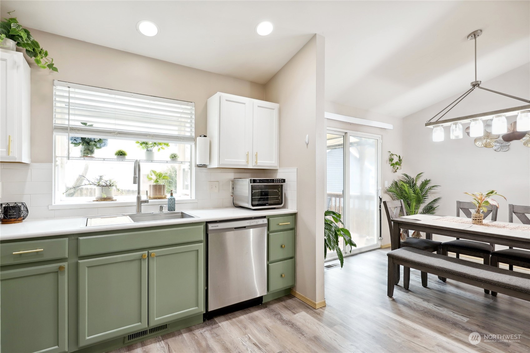 2977 Lowren Loop Port Orchard, WA 98366 - Photo 11 of 33 a kitchen with sink cabinets and wooden floor