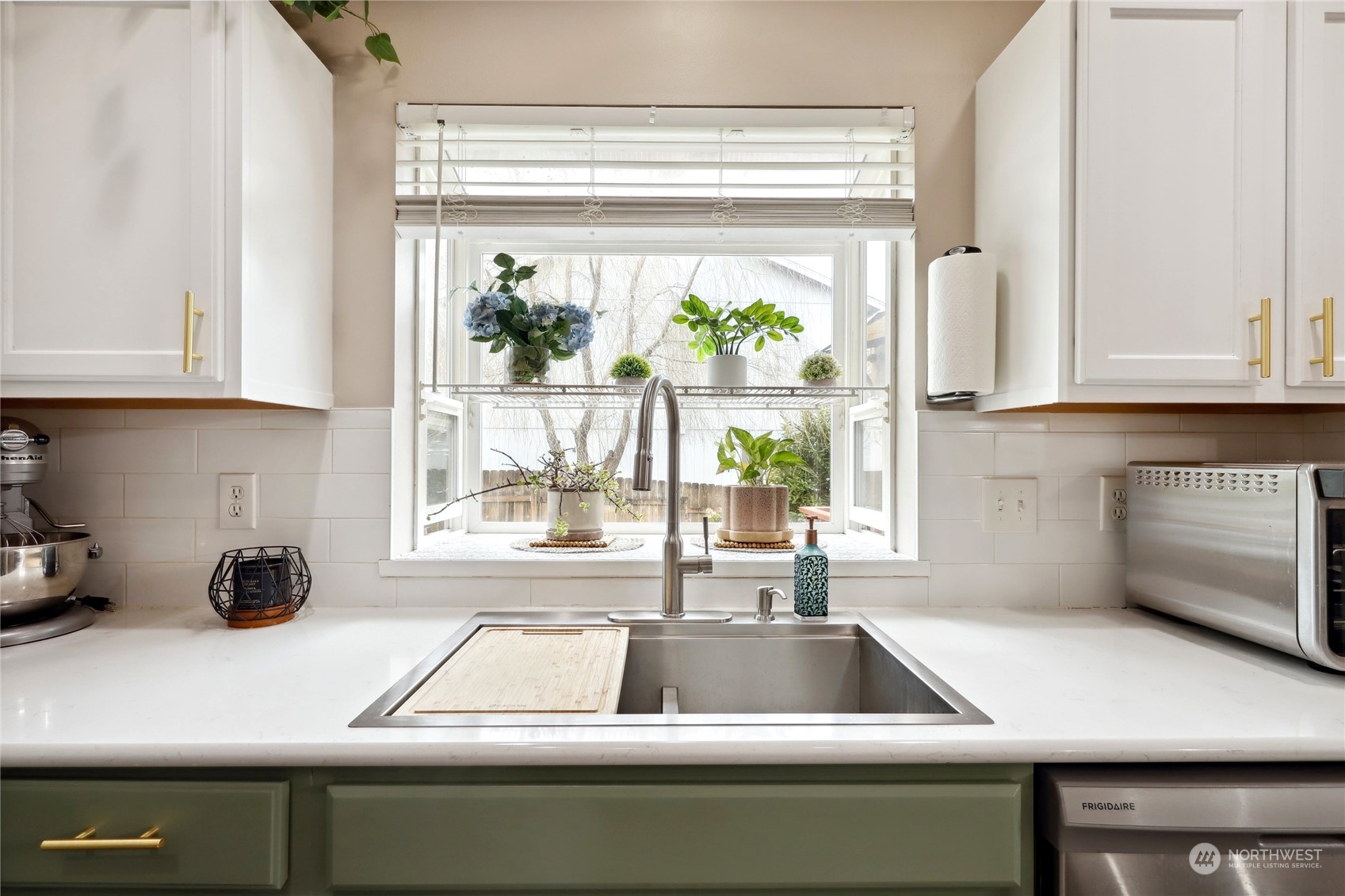 2977 Lowren Loop Port Orchard, WA 98366 - Photo 13 of 33 a kitchen with a sink and cabinets