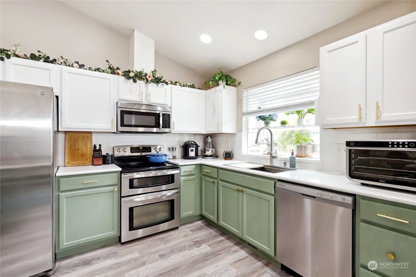 2977 Lowren Loop Port Orchard, WA 98366 - Photo 14 of 33 a kitchen with cabinets stainless steel appliances and a window