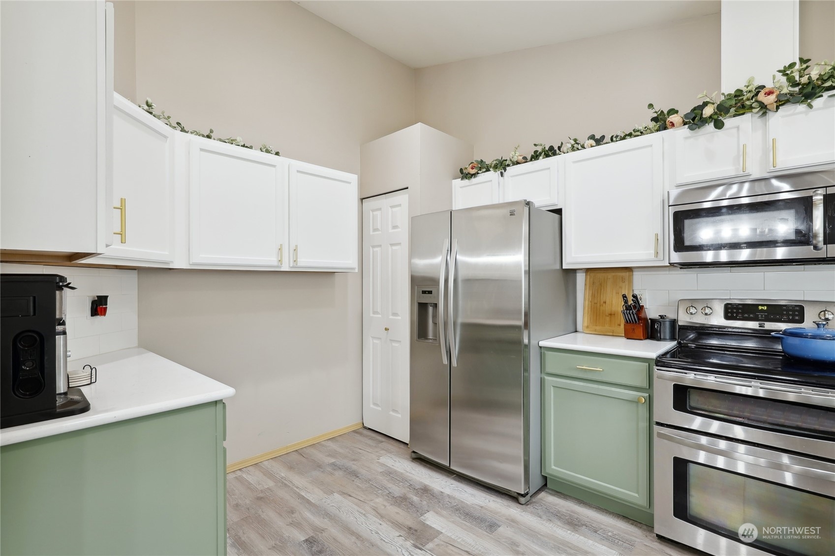 2977 Lowren Loop Port Orchard, WA 98366 - Photo 15 of 33 a kitchen with granite countertop a refrigerator and a stove top oven