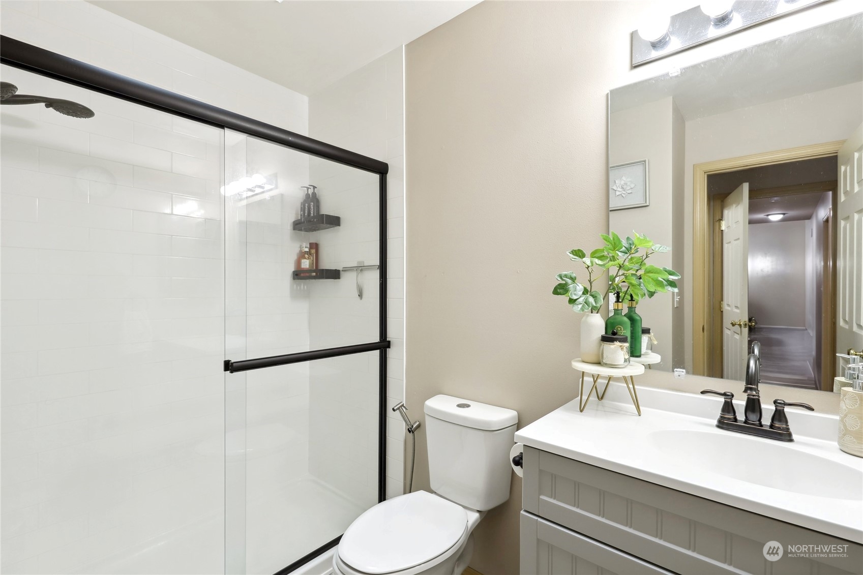 2977 Lowren Loop Port Orchard, WA 98366 - Photo 22 of 33 a bathroom with a sink vanity mirror and toilet