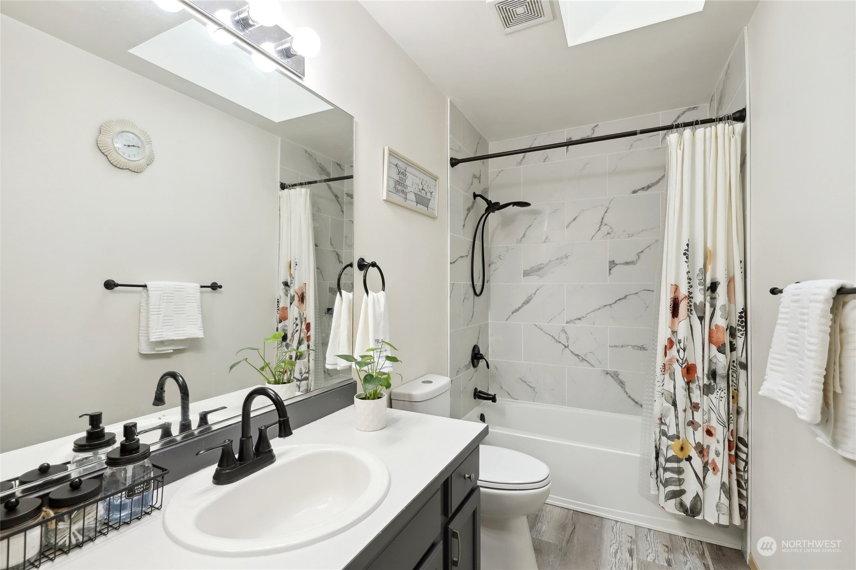 2977 Lowren Loop Port Orchard, WA 98366 - Photo 24 of 33 a bathroom with a sink toilet and shower