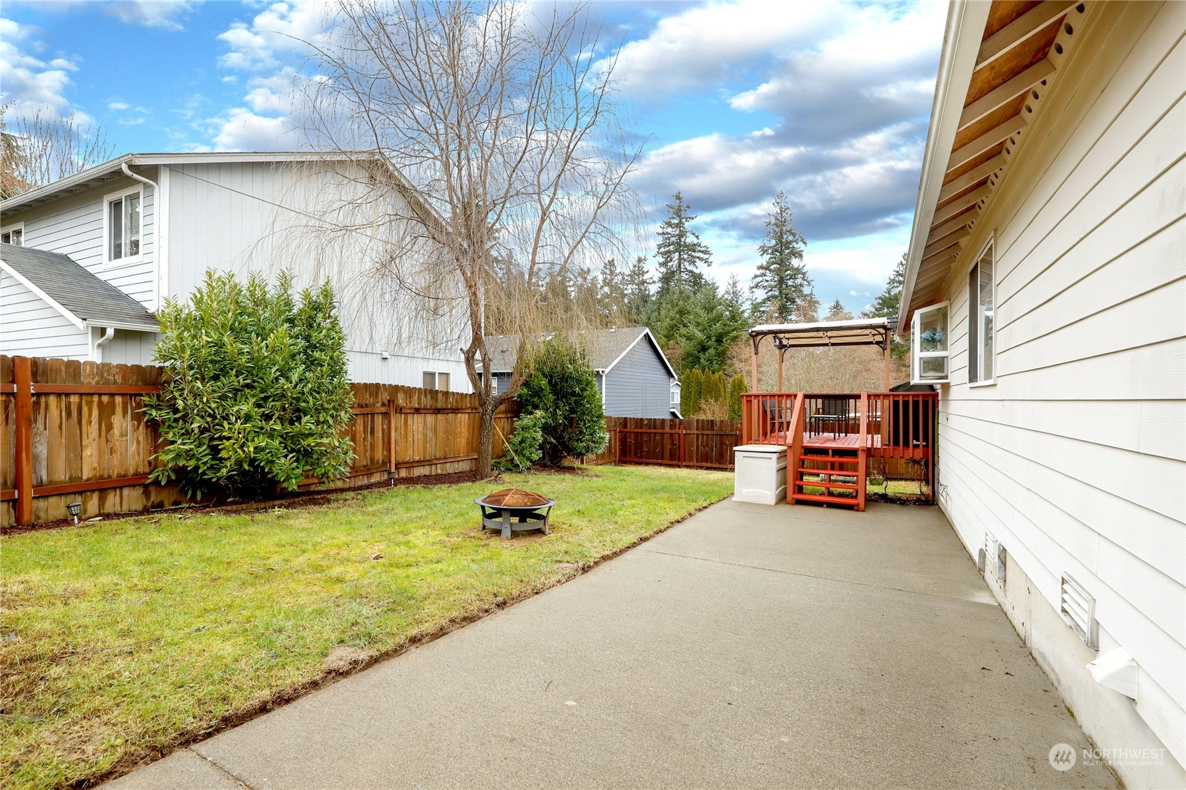 2977 Lowren Loop Port Orchard, WA 98366 - Photo 30 of 33 a view of a house with sitting area and garden