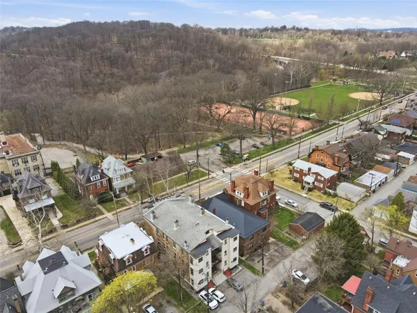 an aerial view of residential building with parking space