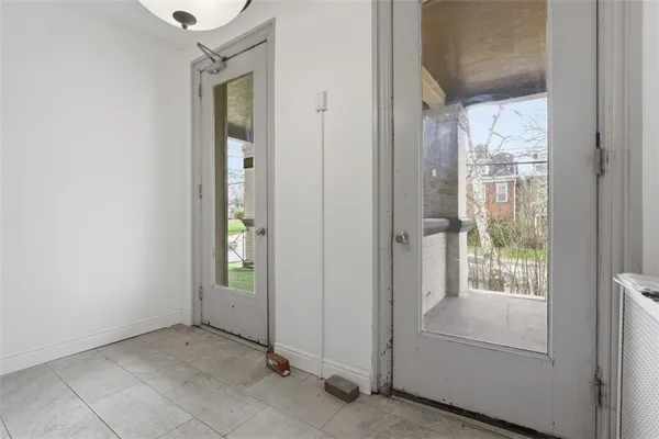 a view of an entryway with wooden floor