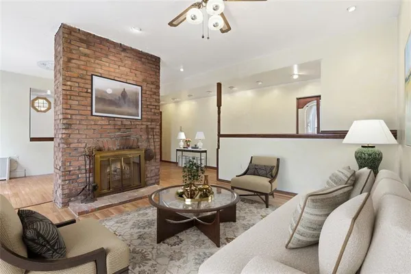 a living room with furniture and a fireplace