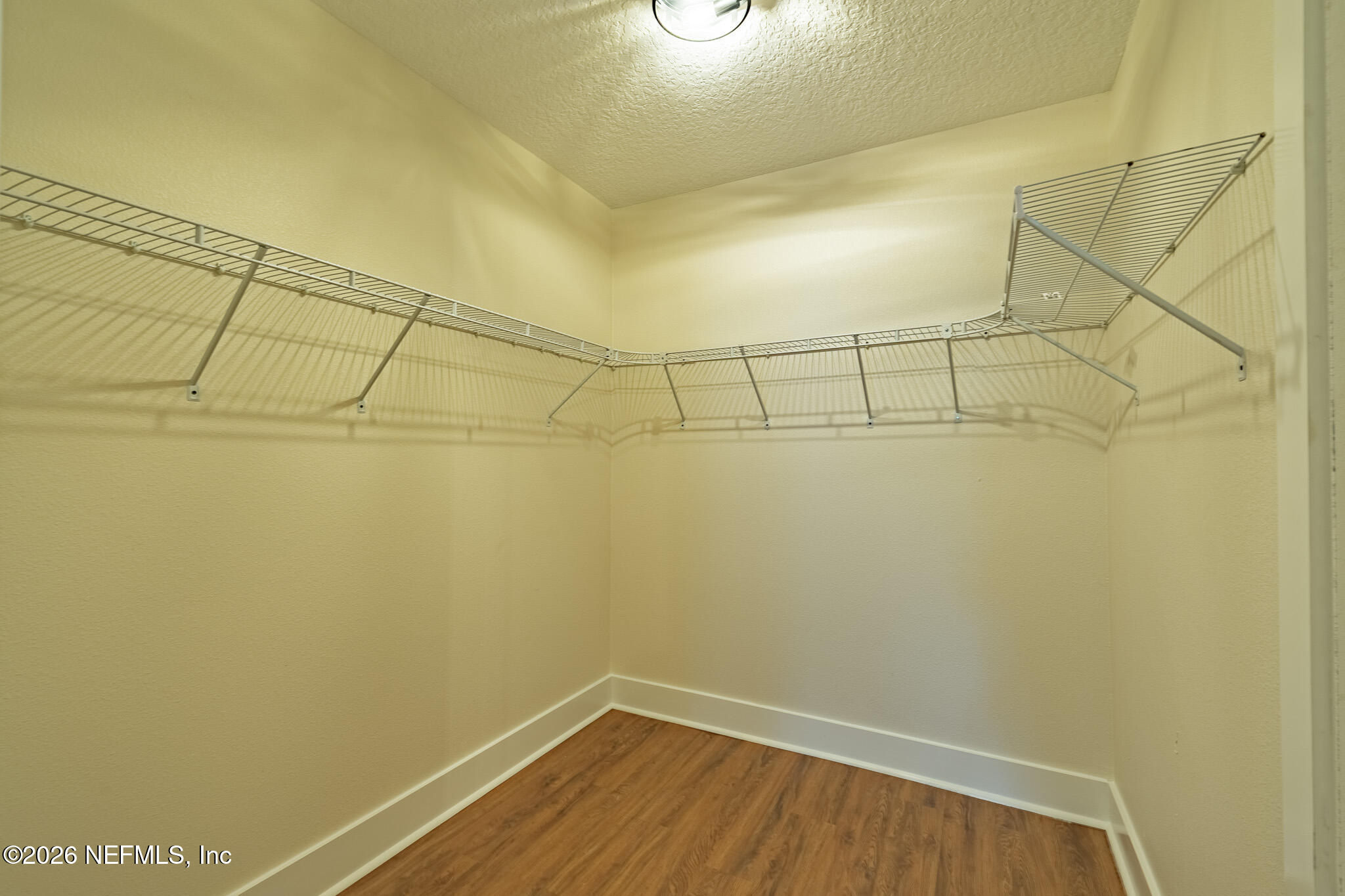 45035 James Street Callahan, FL 32011 - Photo 13 of 21 a view of a room with racks on the wall
