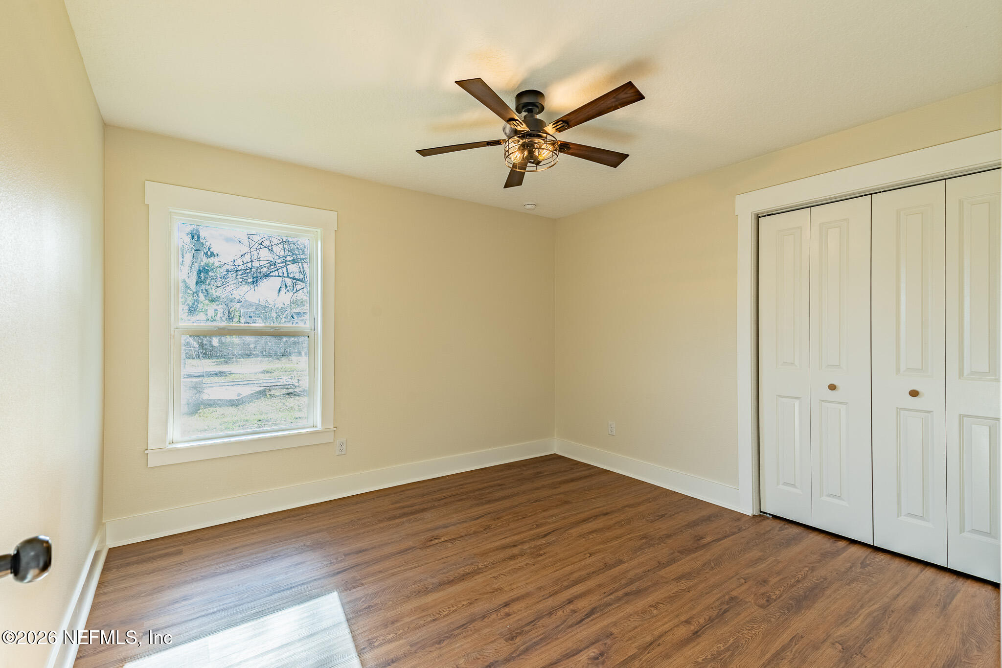 45035 James Street Callahan, FL 32011 - Photo 18 of 21 wooden floor in an empty room with a window