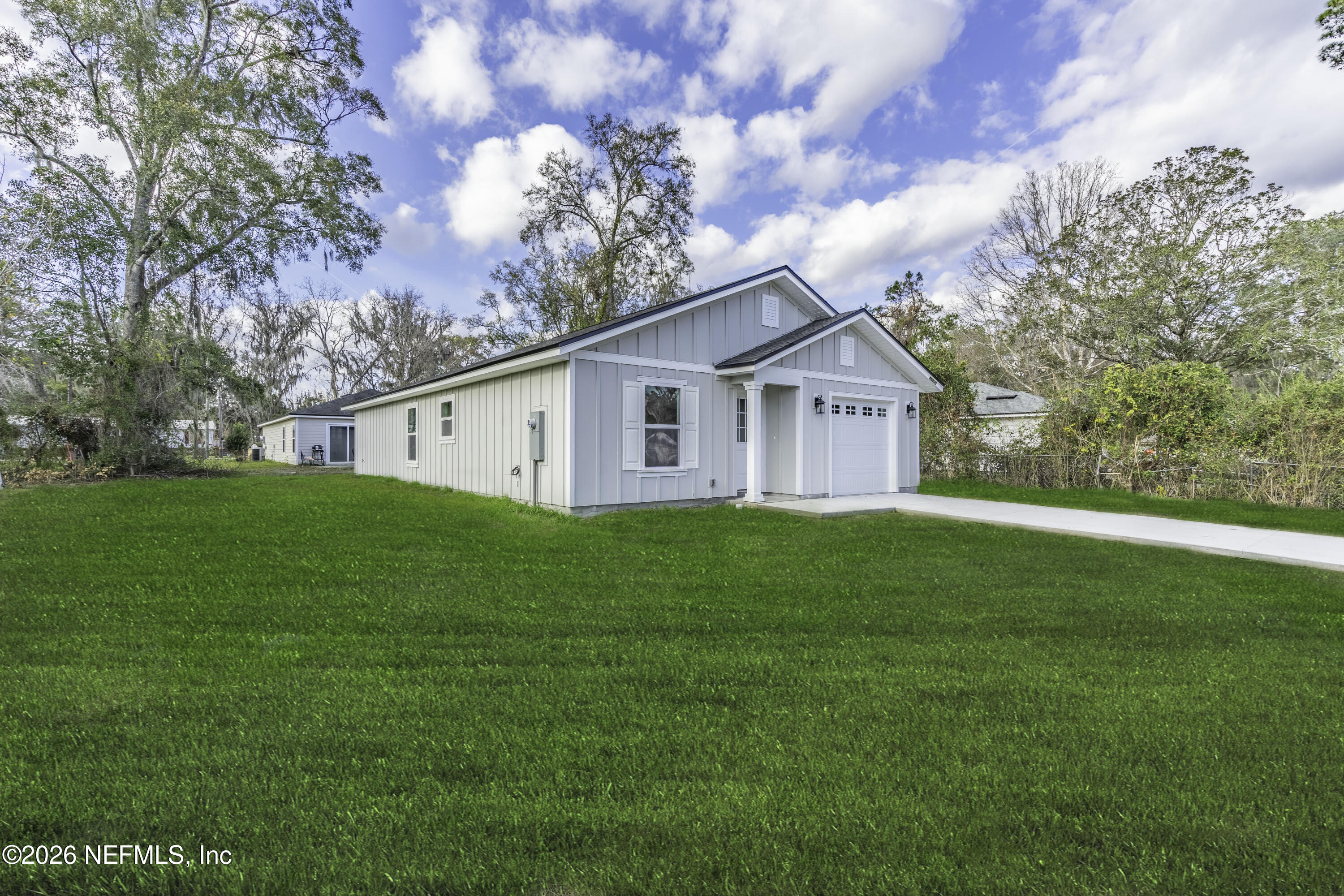 45035 James Street Callahan, FL 32011 - Photo 3 of 21 a view of a house with backyard and garden