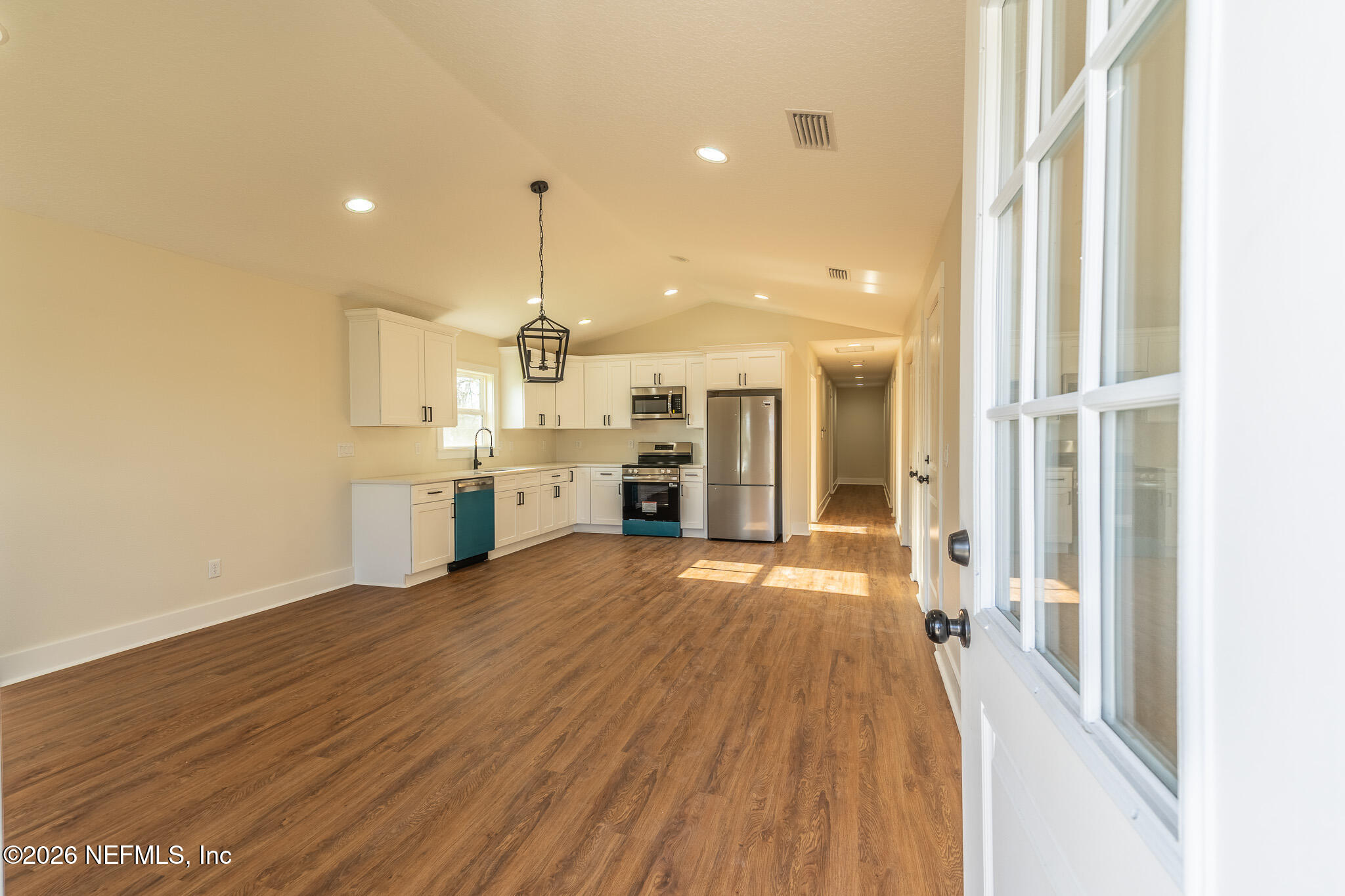45035 James Street Callahan, FL 32011 - Photo 5 of 21 a view of a kitchen with wooden floor and a kitchen