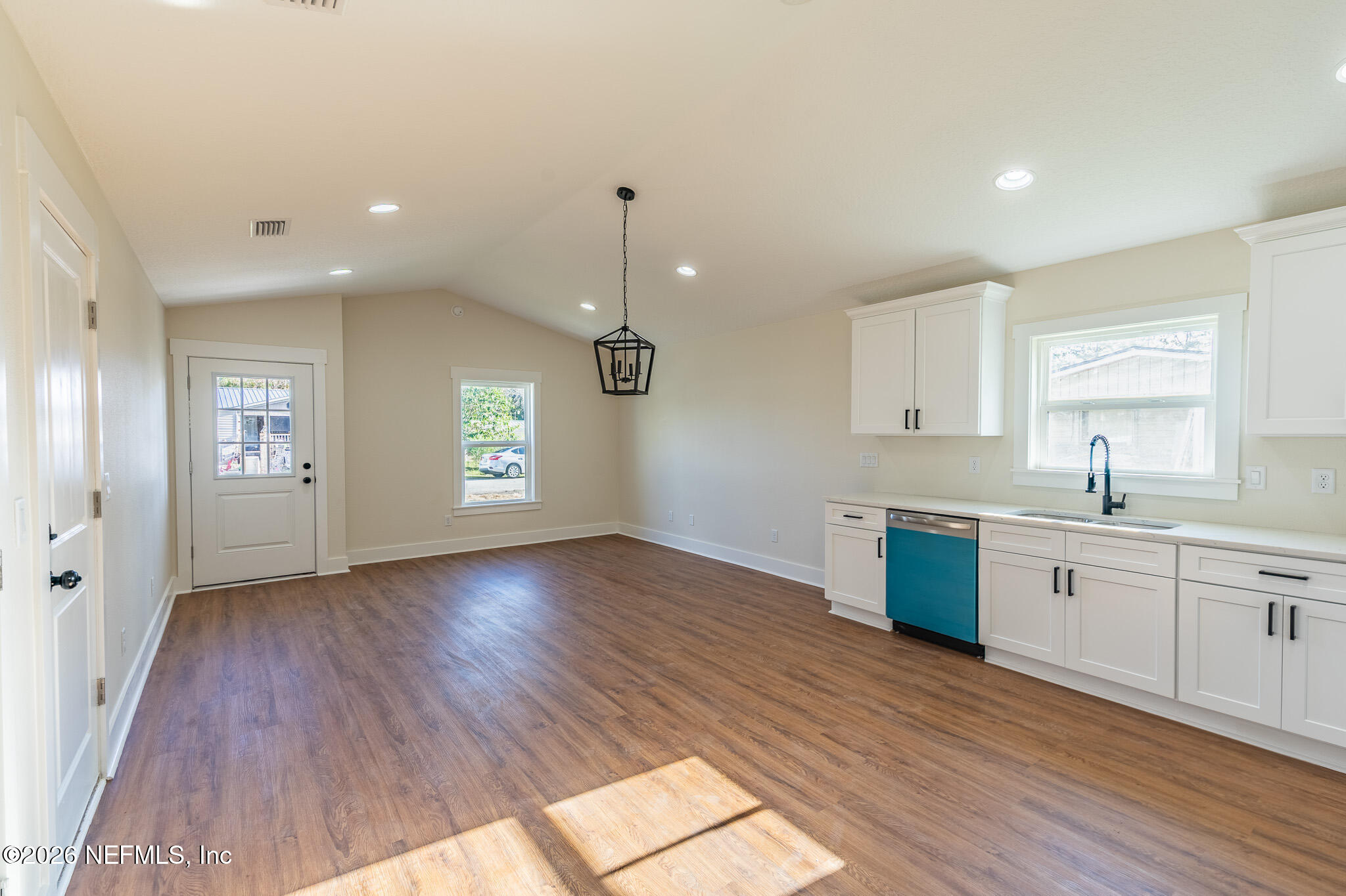 45035 James Street Callahan, FL 32011 - Photo 7 of 21 a large kitchen with hardwood floor and a sink