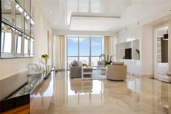 a living room with fireplace furniture and a flat screen tv