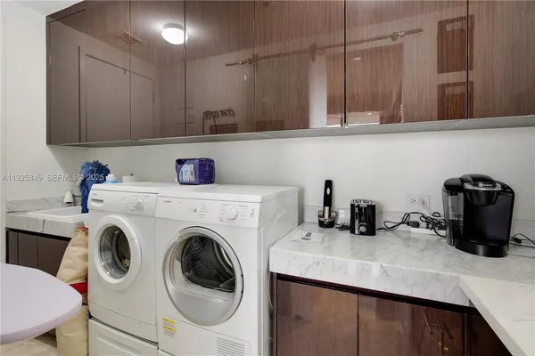 a kitchen with a sink a stove and cabinets