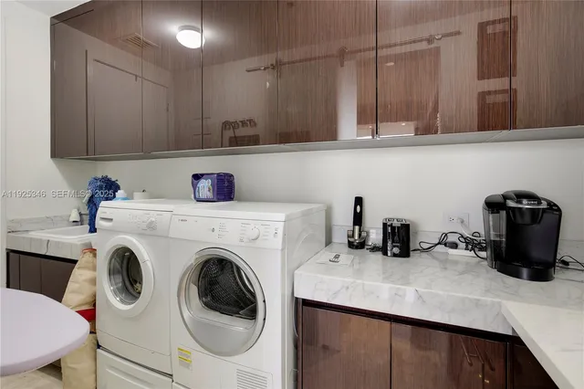 a kitchen with a sink a stove and cabinets