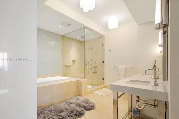 a bathroom with a sink and a shower