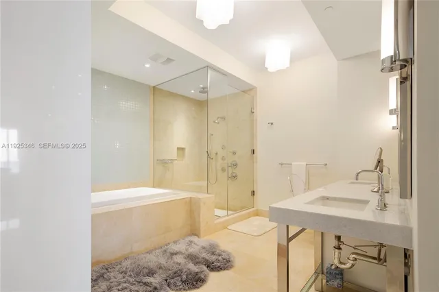 a bathroom with a sink and a shower