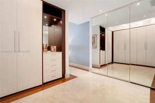 a lobby with furniture and a floor to ceiling window