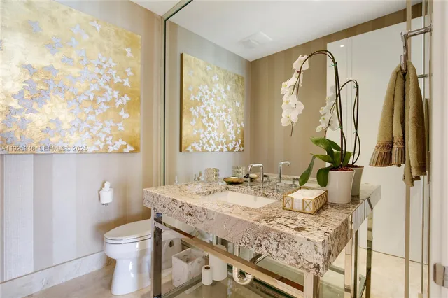 a bedroom with a bed and a lamp