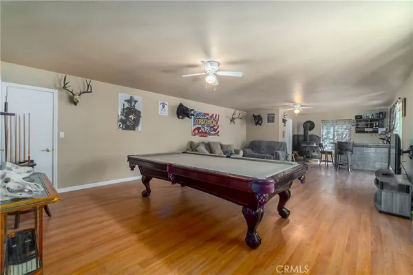 a room with furniture and wooden floor