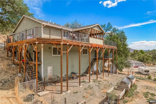 a view of a house with wooden deck