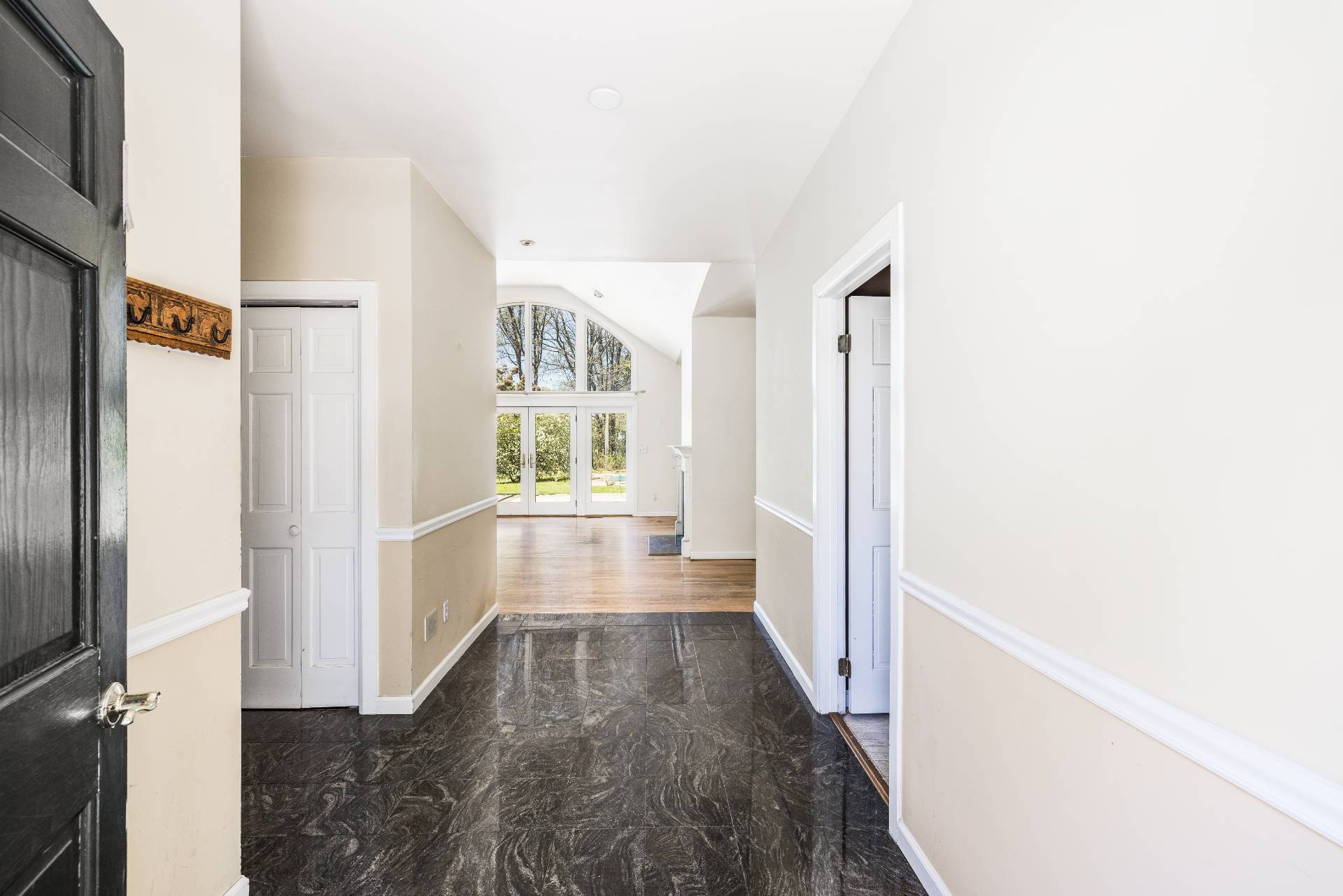 23 Fieldview Lane East Hampton, NY 11937 - Photo 4 of 16 a view of a hallway with wooden floor and staircase