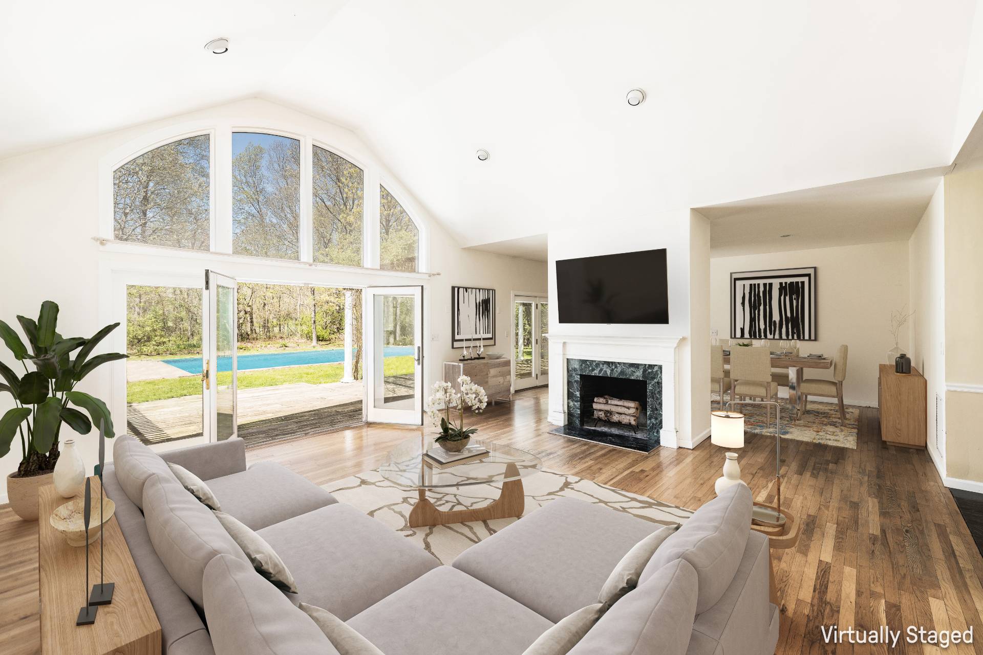 23 Fieldview Lane East Hampton, NY 11937 - Photo 6 of 16 a living room with furniture a fireplace and a floor to ceiling window