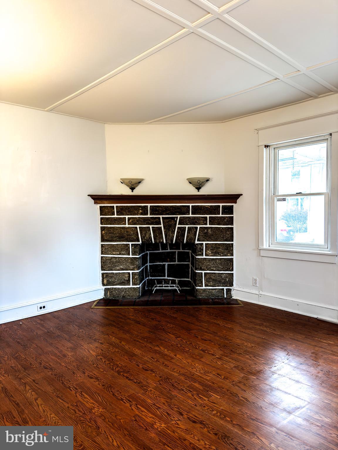 an empty room with wooden floor