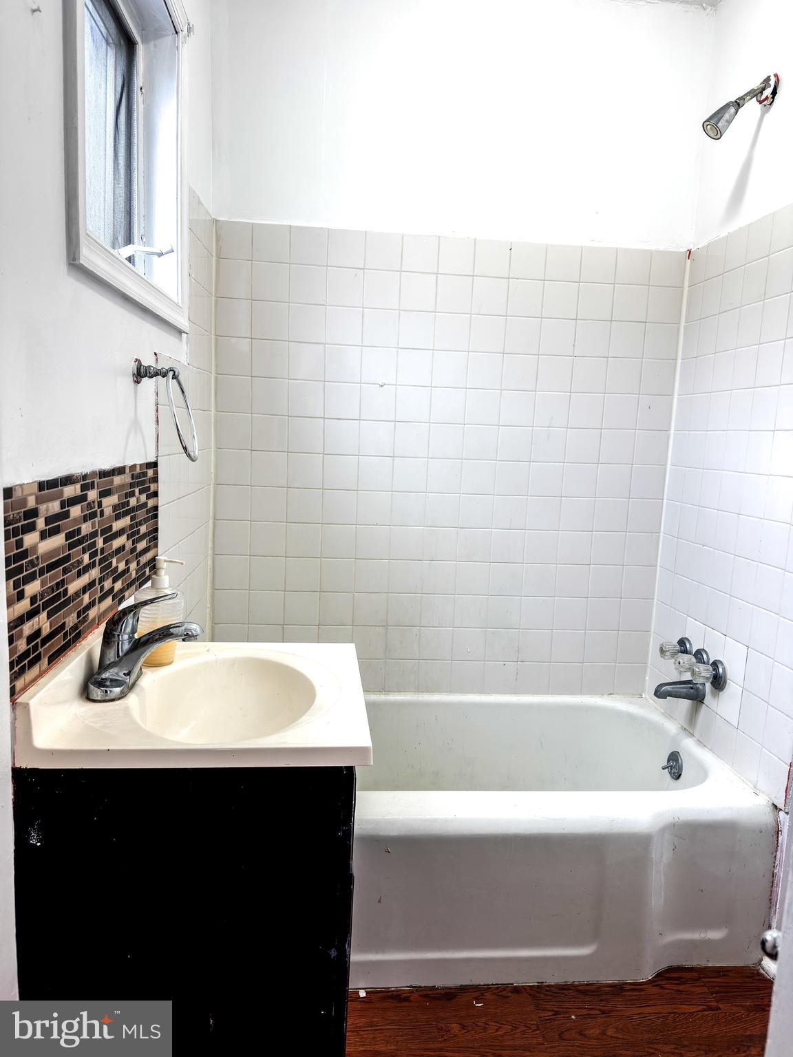 234 Windsor Avenue Upper Darby, PA 19082 - Photo 14 of 28 a bathroom with a sink and a bathtub