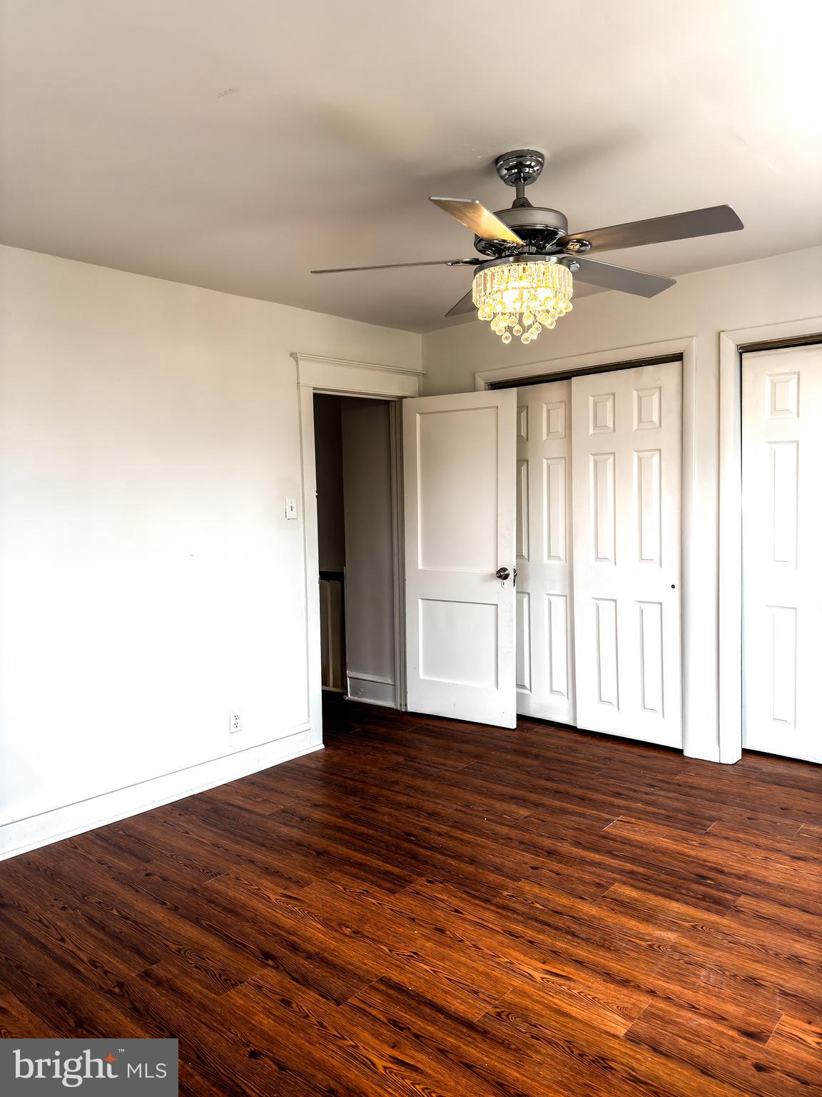 234 Windsor Avenue Upper Darby, PA 19082 - Photo 2 of 28 a view of an empty room with wooden floor and a window