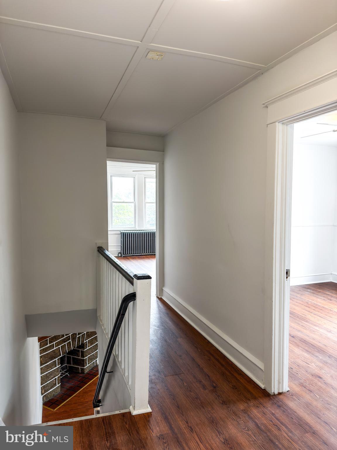 234 Windsor Avenue Upper Darby, PA 19082 - Photo 22 of 28 a view of a hallway with wooden floor