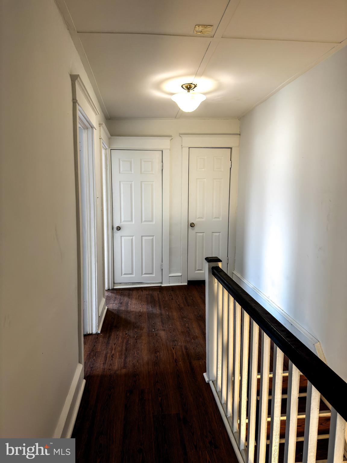 234 Windsor Avenue Upper Darby, PA 19082 - Photo 23 of 28 a view of a hallway with wooden floor