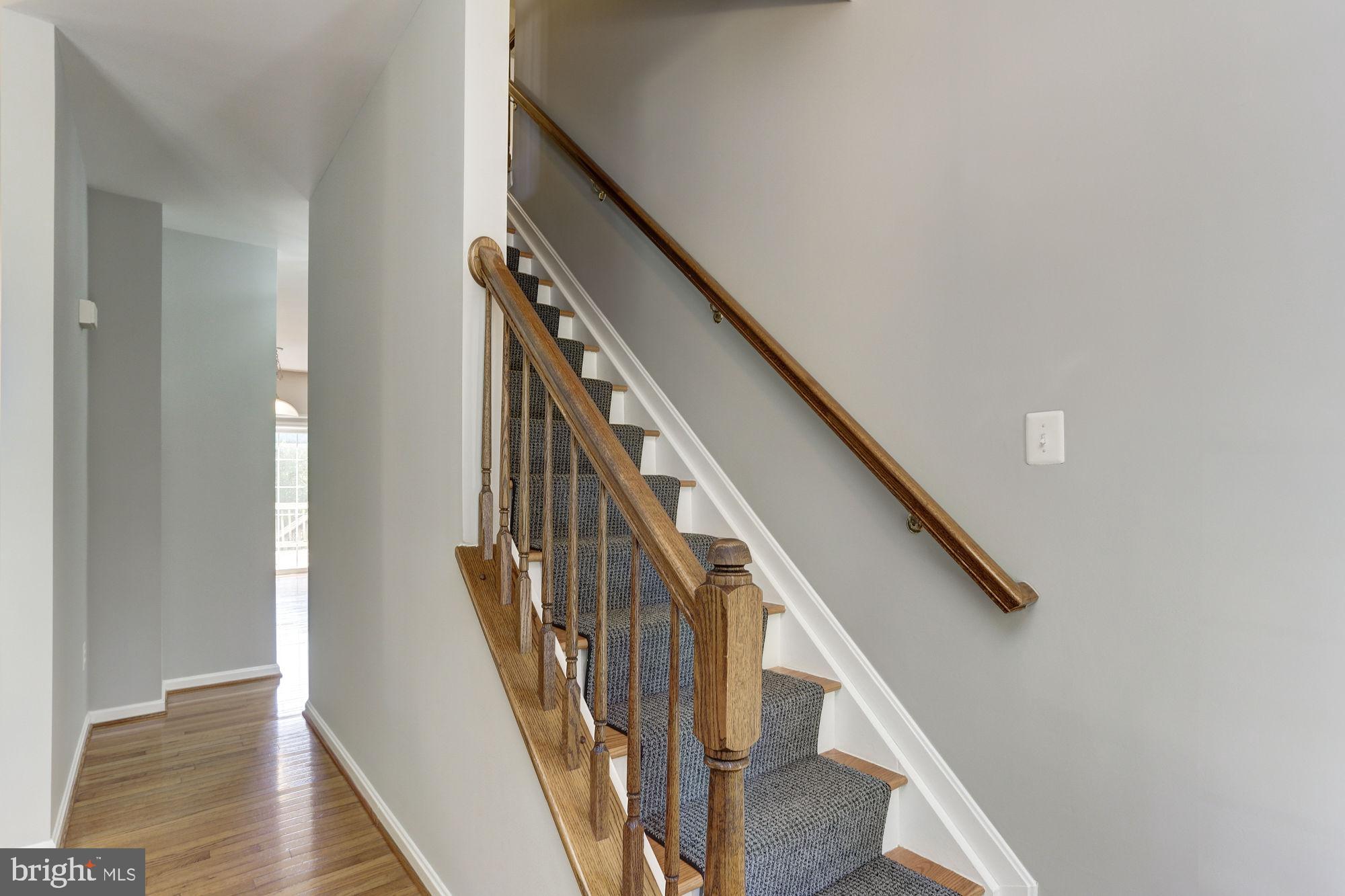 10689 Stansfield Road Laurel, MD 20723 - Photo 18 of 52 Entry foyer with hardwood stairs to upper level