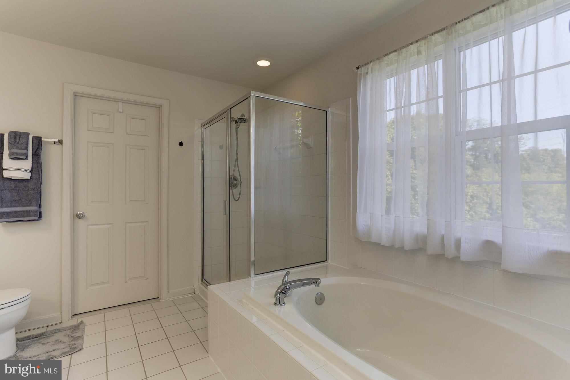 10689 Stansfield Road Laurel, MD 20723 - Photo 23 of 52 Primary bath has soaking tub and shower