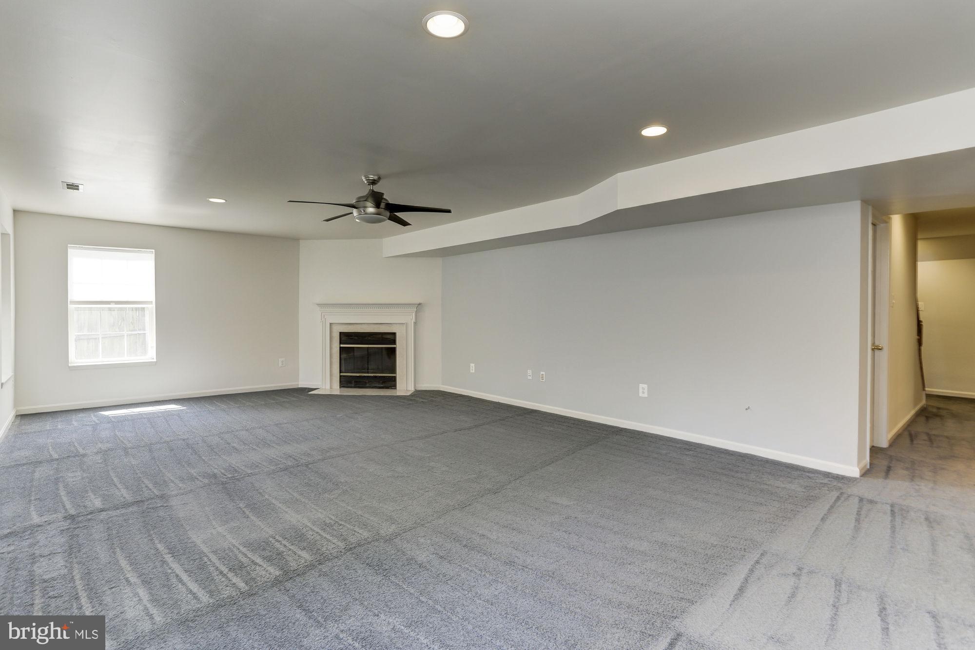 10689 Stansfield Road Laurel, MD 20723 - Photo 36 of 52 Lower level rec room is very light and bright