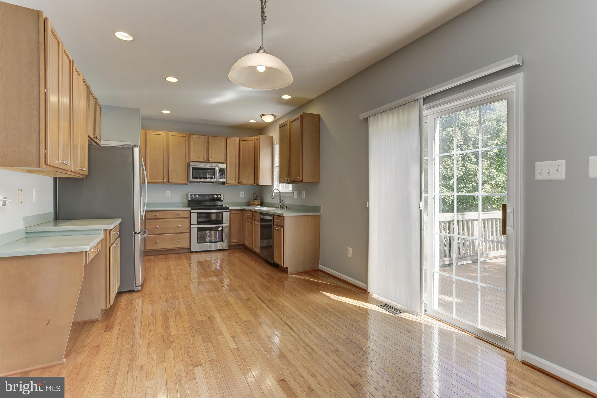 10689 Stansfield Road Laurel, MD 20723 - Photo 9 of 52 Large eat in kitchen has sliders to the deck