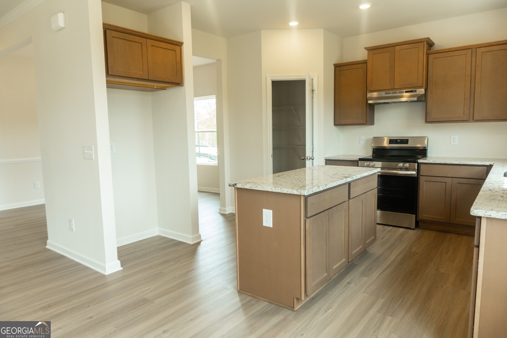 74 Hampton Ridge Way, Unit 39 Jefferson, GA 30549 - Photo 3 of 14 a kitchen with a sink cabinets stainless steel appliances and a window