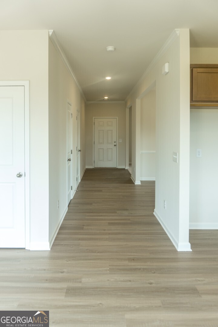 74 Hampton Ridge Way, Unit 39 Jefferson, GA 30549 - Photo 5 of 14 a view of a hallway with wooden floor
