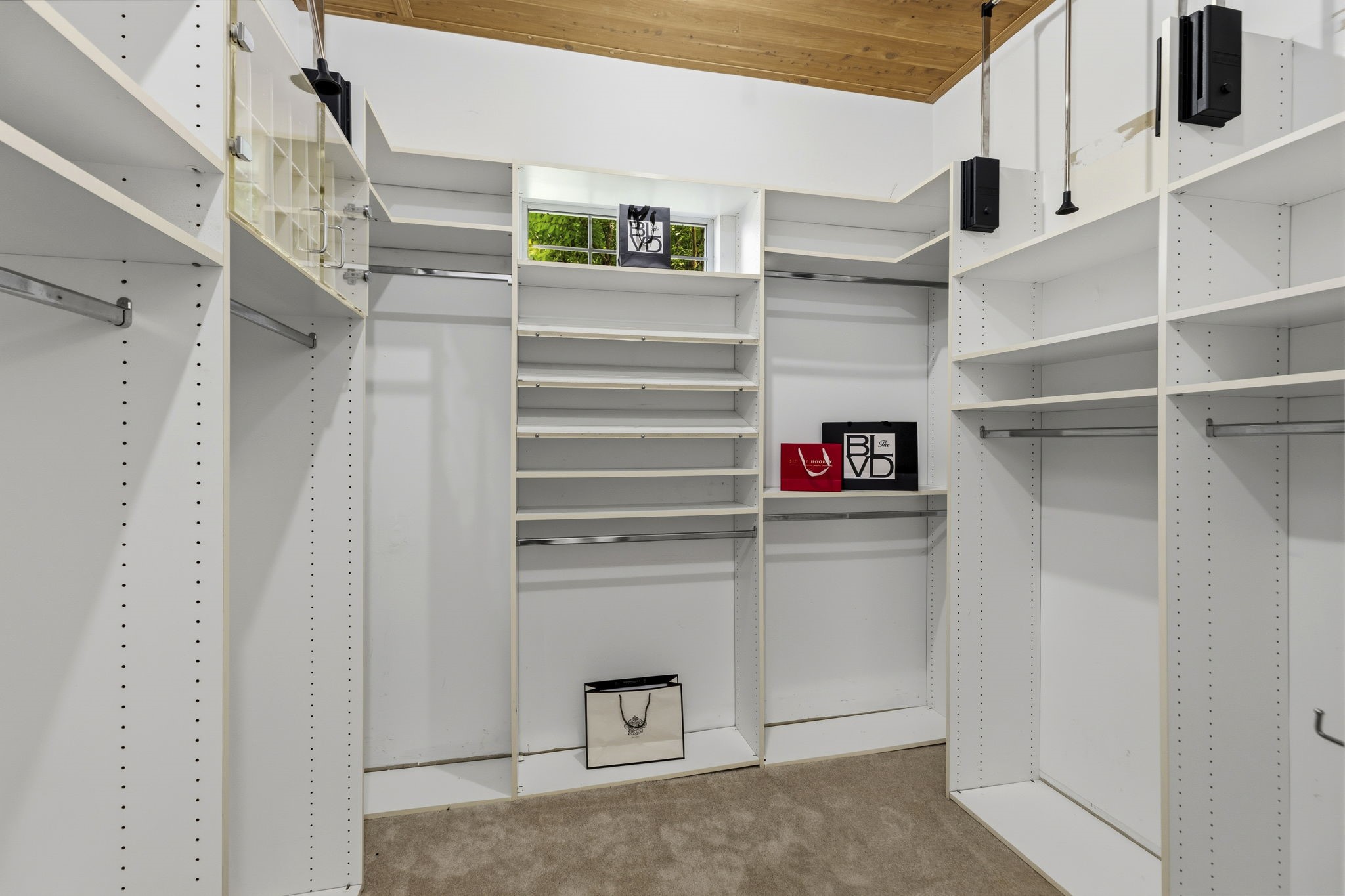 18310 Pamela Way Spring, TX 77379 - Photo 25 of 42 One of two large primary closets with customized built-in organization and functional storage.
This description provides clear, high-value information for prospective buyers by highlighting the functional storage features of the home. Including specific details like "customized built-in organization" helps differentiate the property and justifies the "primary" designation by emphasizing quality and convenience.