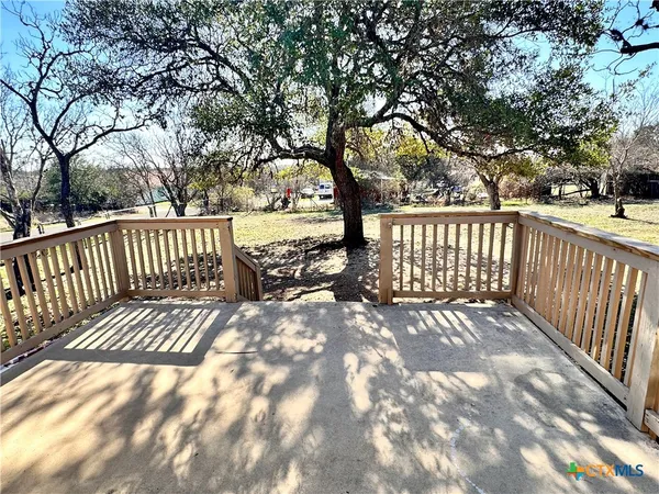 a view of deck with wooden floor and fence