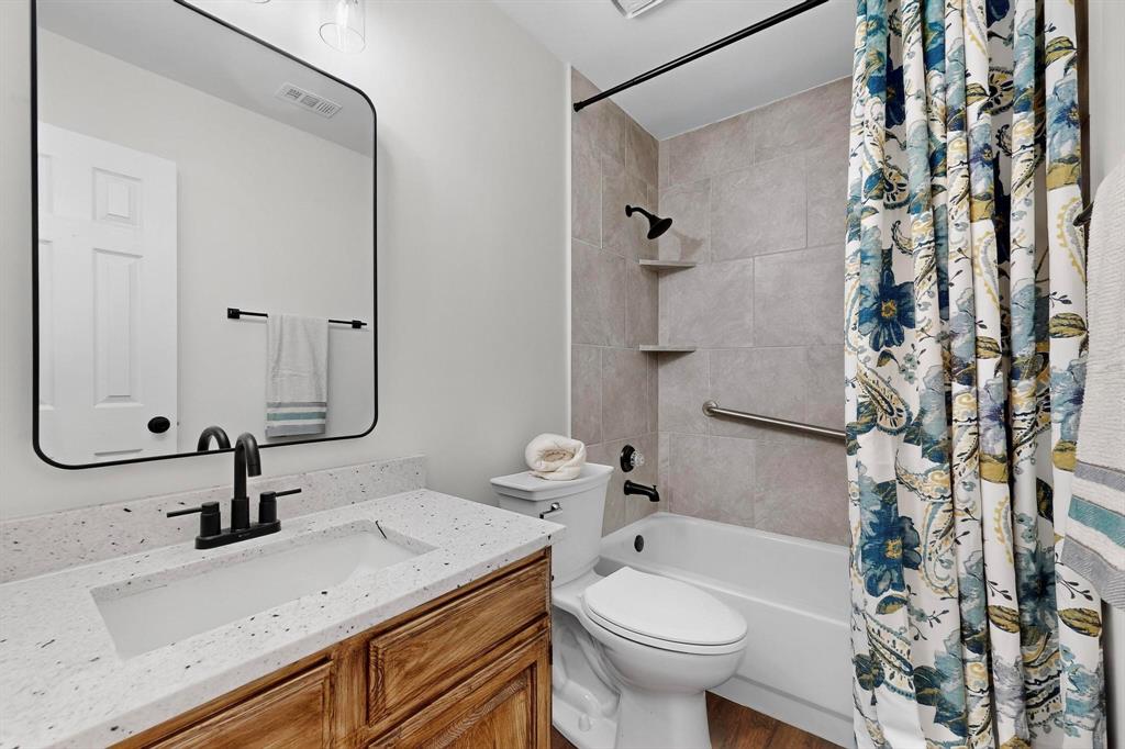 2601 Daisy Lane Rowlett, TX 75089 - Photo 17 of 36 a bathroom with a sink toilet and shower