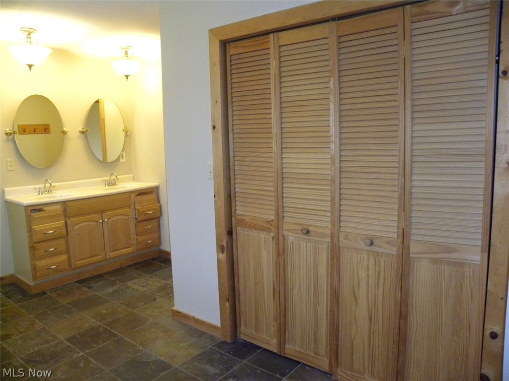 6481 Root Road Conneaut, OH 44030 - Photo 12 of 25 Master bath featuring double bowl sink and walk-in shower