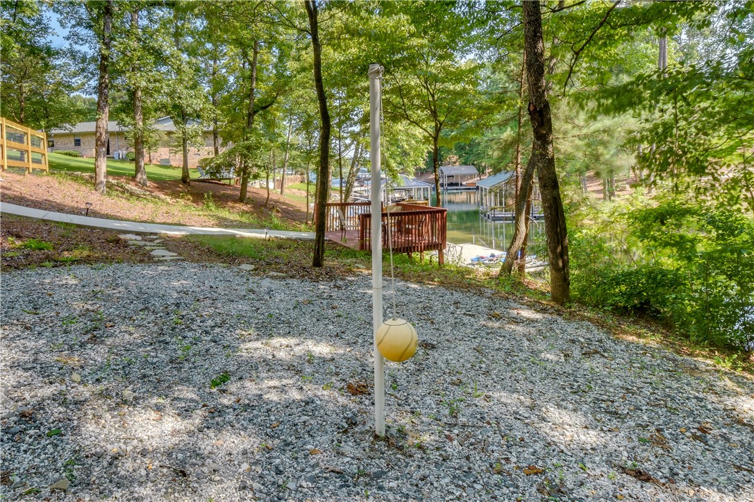206 Petty Road Seneca, SC 29672 - Photo 42 of 48 A tranquil lakefront property awaits, offering direct access to the water with a private dock.