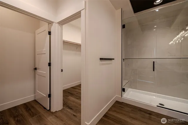 a bathroom with a bathtub and a shower